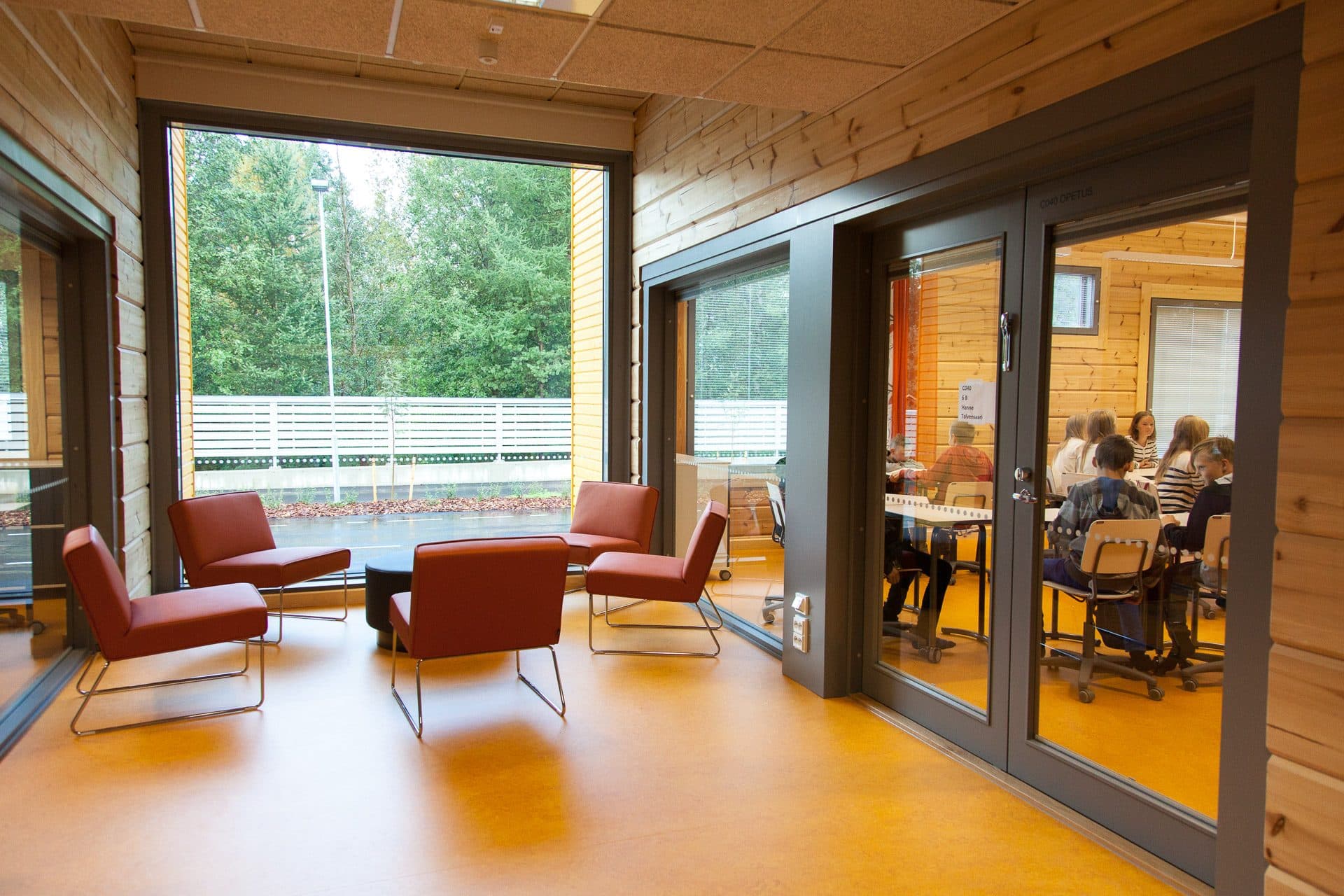Bright interior of a KONTIO solid-wood school with large glazing, Pudasjärvi, Finland