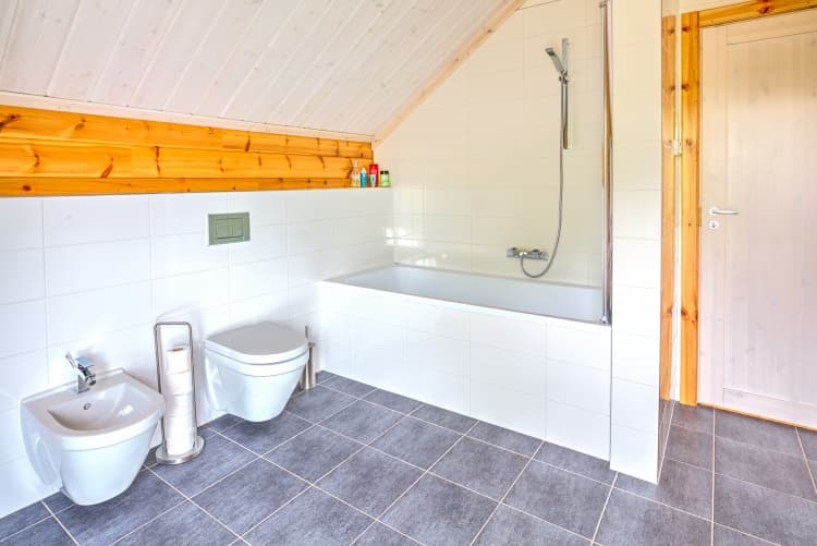 KONTIO log homes — loft bathroom