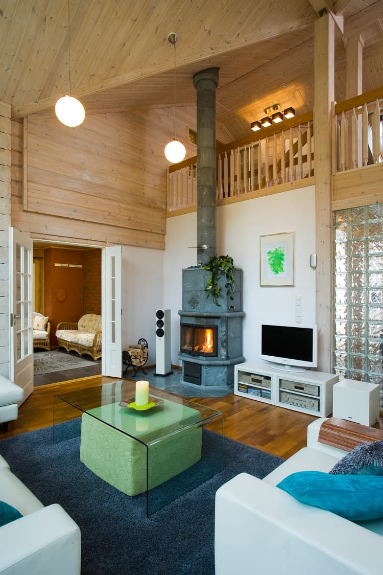 KONTIO Finnish log homes — stove in the living room