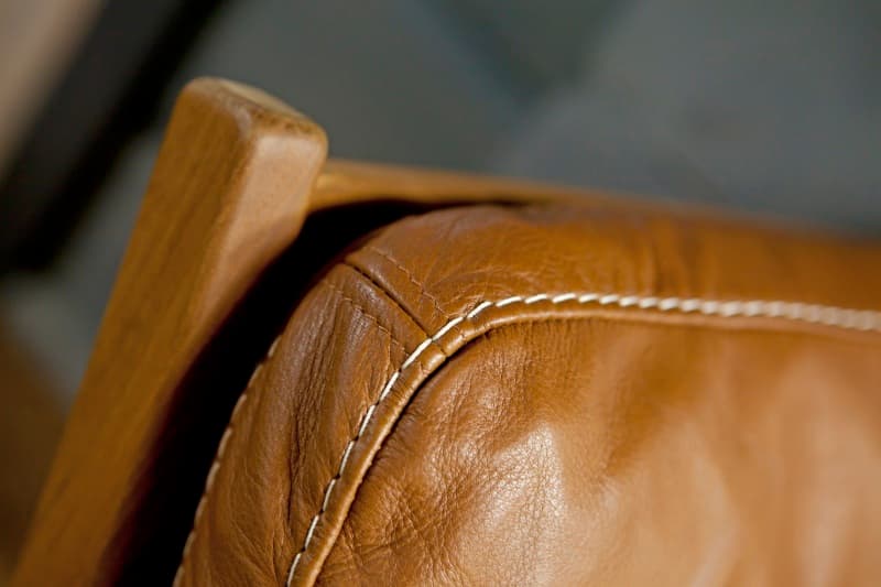 Detail of a stitched leather armchair back in a KONTIO home