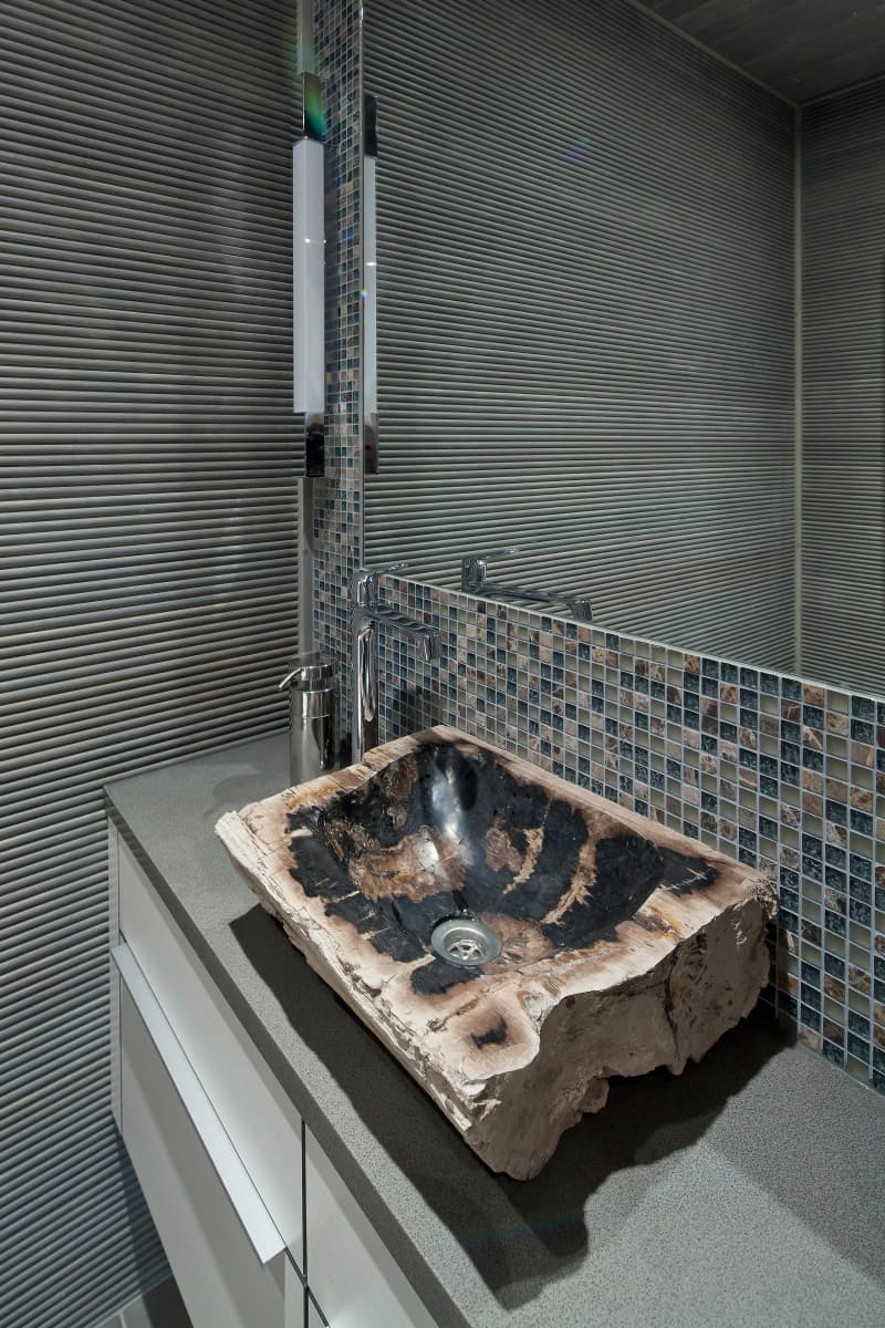 Luxury KONTIO mountain log cabin, detail of a wooden washbasin