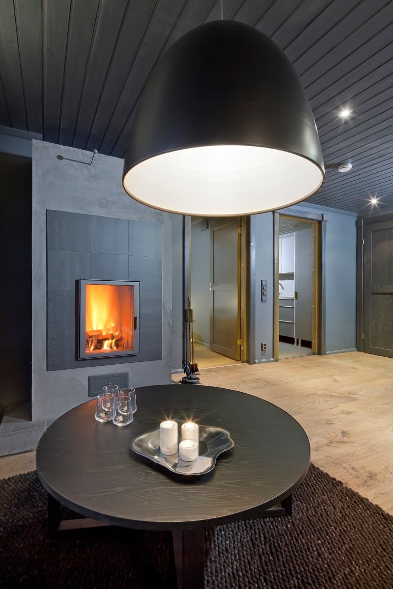 Luxury KONTIO log home, ground-floor living room with Artemide lighting