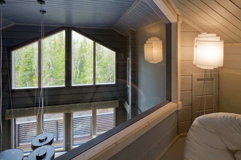 View from the first-floor bedroom into the living room of a KONTIO log home