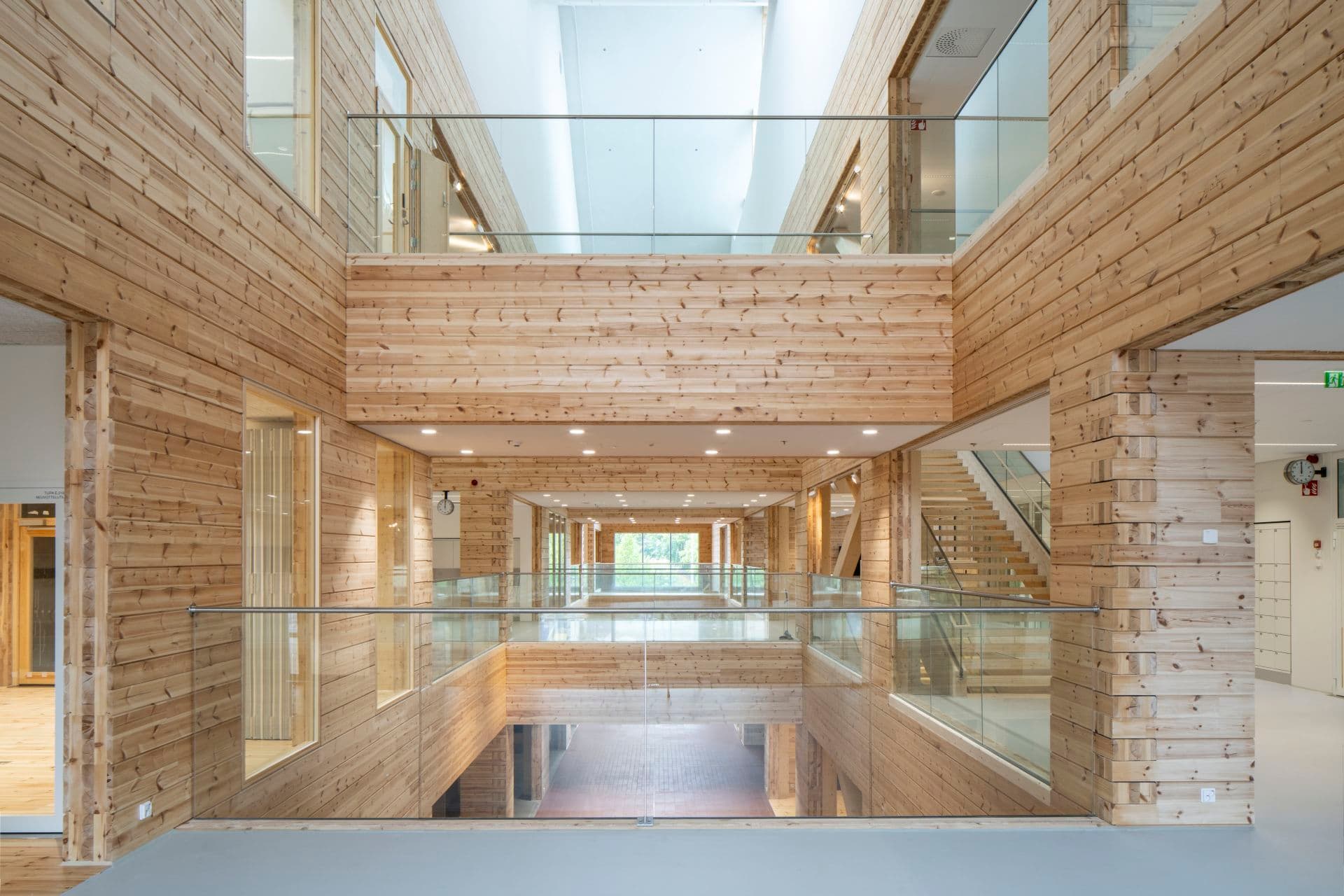 Interior of the KONTIO Monio building in Tuusula — a bright multi-storey atrium with a CLT structure